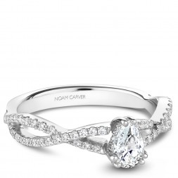 A Carver Studio white gold engagement ring with a twist band, a pear center stone and 57 diamonds.