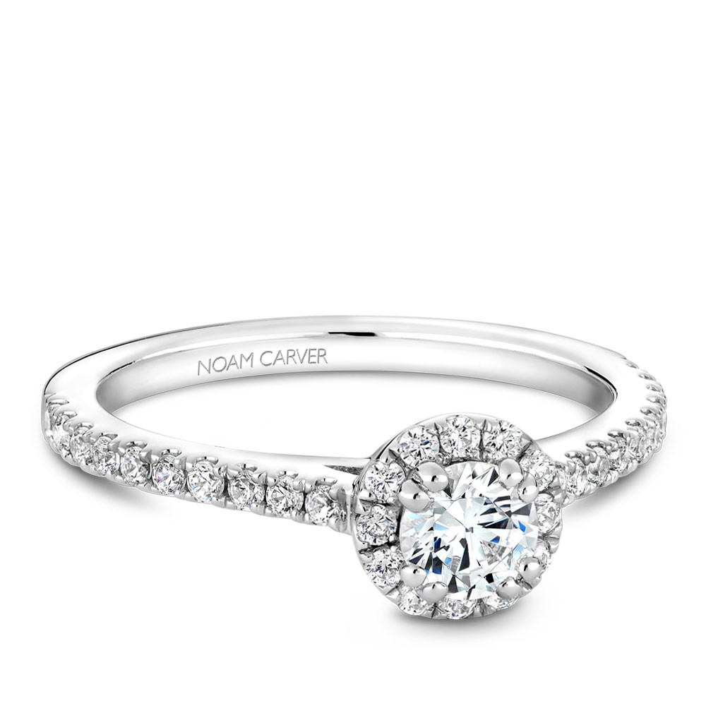 A Carver Studio white gold engagement ring with a halo.