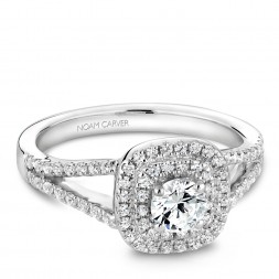 A Carver Studio white gold engagement ring with a double halo .