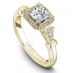 A vintage Carver Studio yellow gold engagement ring with a princess center stone and 23 diamonds.