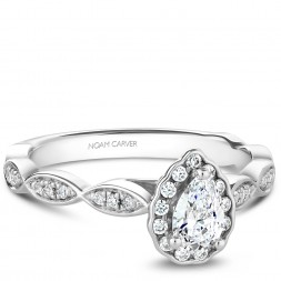 A Carver Studio white gold engagement ring with a pear floral halo and 38 diamonds.