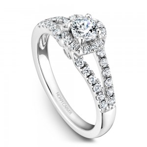 A Carver Studio white gold engagement ring with an oval halo and 39 diamonds.