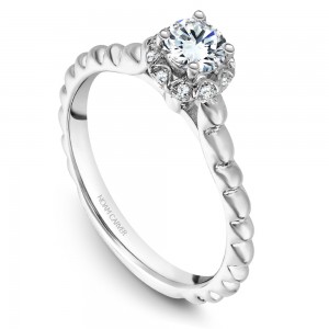 A floral Carver Studio white gold engagement ring with 21 diamonds.