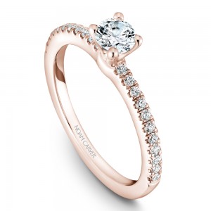 A solitaire Carver Studio rose gold engagement ring with 23 diamonds.