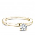 A solitaire Carver Studio yellow gold engagement ring with a round center stone.