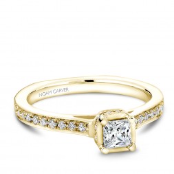 A solitaire Carver Studio yellow gold engagement ring with a princess diamond and 35 diamonds.