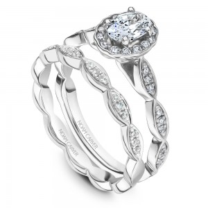 A Carver Studio white gold engagement ring with an oval floral halo and 39 diamonds.