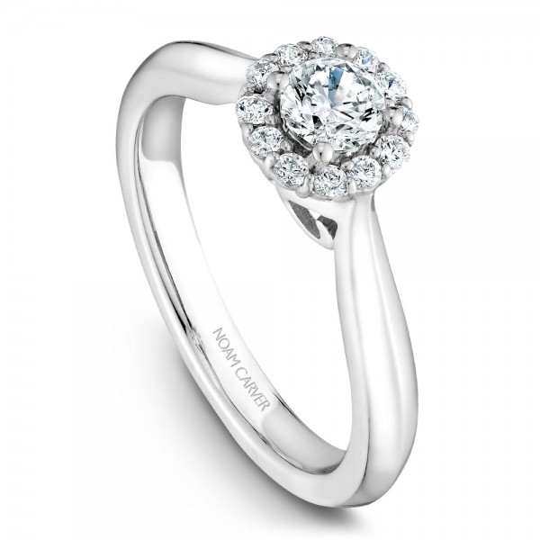 A floral Carver Studio white gold engagement ring with a halo and 13 diamonds.