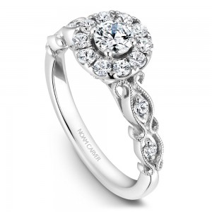 A floral Carver Studio white gold engagement ring with a halo and 17 diamonds.