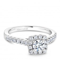 A Carver Studio white gold engagement ring with a square halo and 25 diamonds.