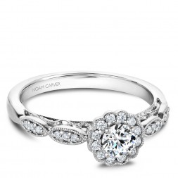 A floral Carver Studio white gold engagement ring with 25 diamonds.