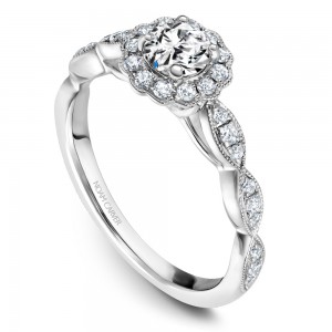 A floral Carver Studio white gold engagement ring with a halo and 31 diamonds.