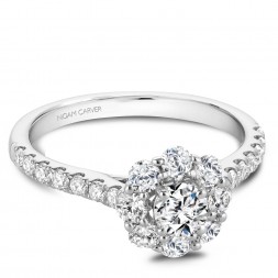 A floral Carver Studio white gold engagement ring with a halo and 23 diamonds.