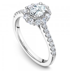 A floral Carver Studio white gold engagement ring with an oval halo and 23 diamonds.