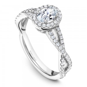 A Carver Studio white gold engagement ring with a twist band, an oval halo and 73 diamonds.