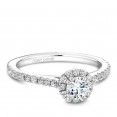 A Carver Studio white gold engagement ring with a halo.