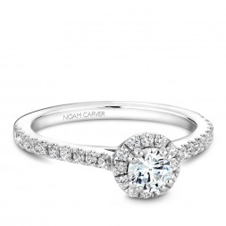 A Carver Studio white gold engagement ring with a halo.