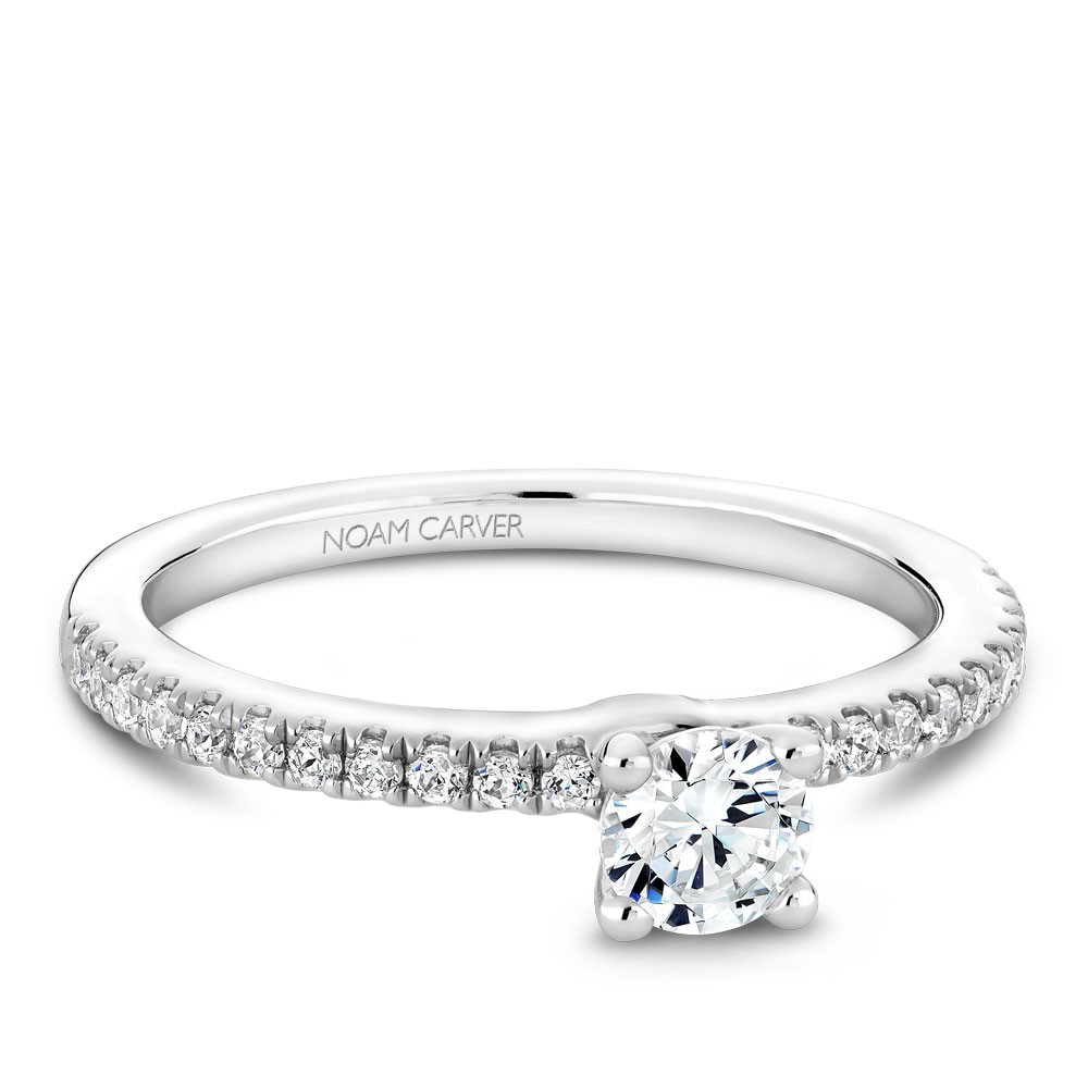 A solitaire Carver Studio white gold engagement ring with 23 diamonds.