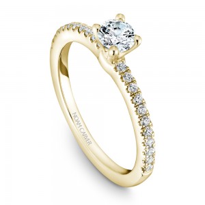 A solitaire Carver Studio yellow gold engagement ring with 23 diamonds.