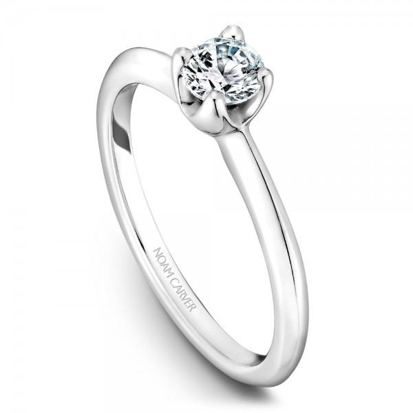 A floral Carver Studio white gold engagement ring with a round center stone.