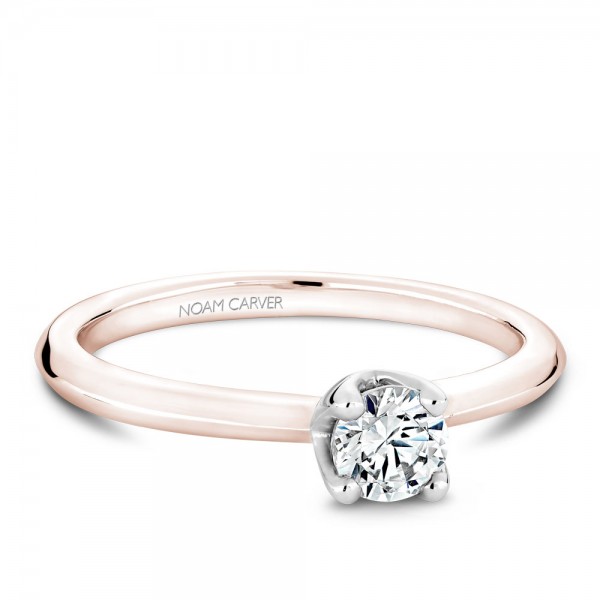 A floral Carver Studio rose and white gold engagement ring with a round center stone.