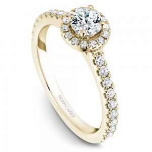 A halo Carver Studio yellow gold engagement ring with a round center stone.