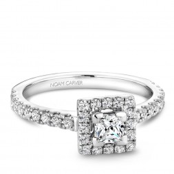 A Carver Studio white gold engagement ring with a square halo .