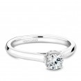 A solitaire Carver Studio white gold engagement ring with 15 diamonds.