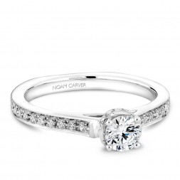 A solitaire Carver Studio white gold engagement ring with 38 diamonds.