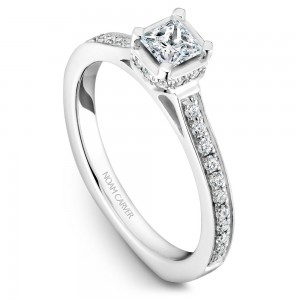 A solitaire Carver Studio white gold engagement ring with a princess diamond and 35 diamonds.