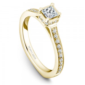 A solitaire Carver Studio yellow gold engagement ring with a princess diamond and 35 diamonds.