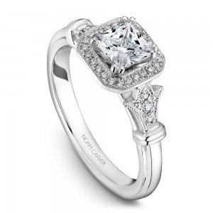 A vintage Carver Studio white gold engagement ring with a princess center stone and 23 diamonds.