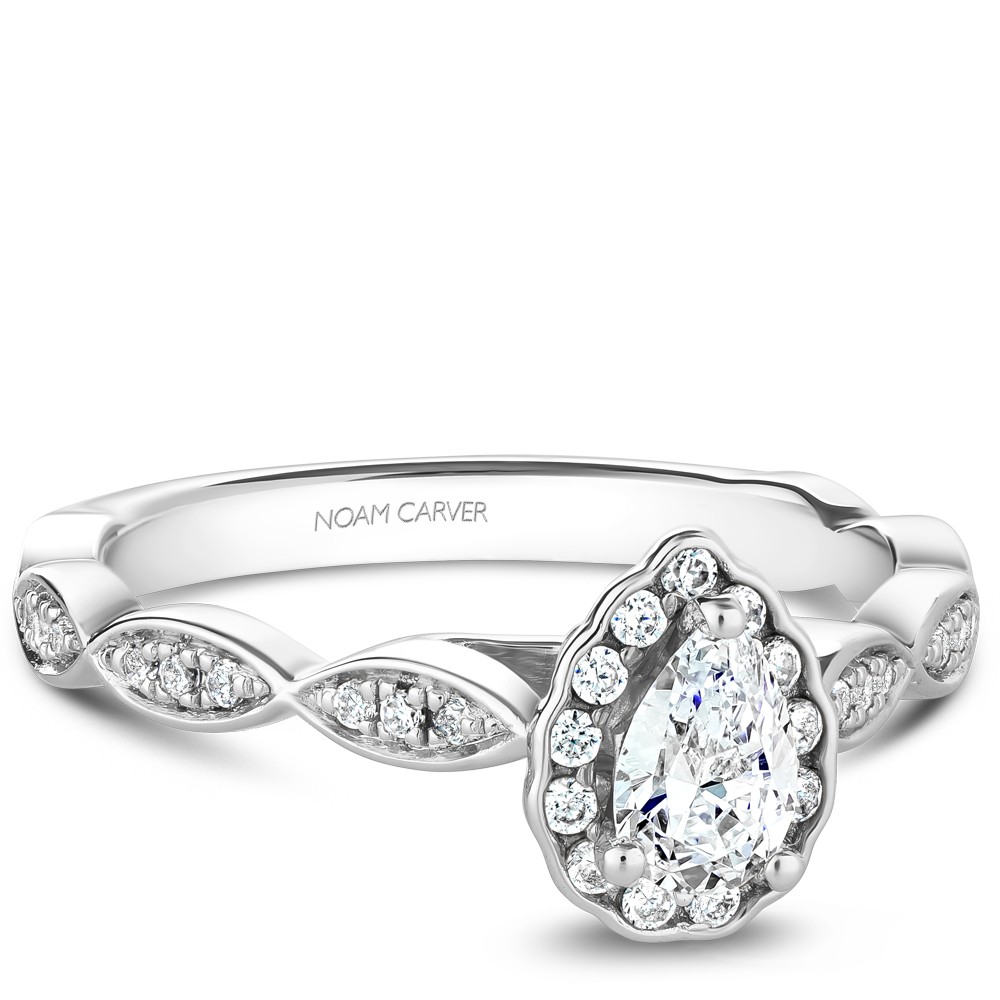 A Carver Studio white gold engagement ring with a pear floral halo and 38 diamonds.