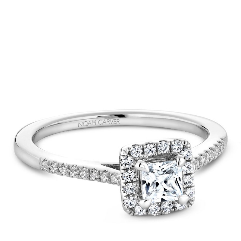 A Carver Studio white gold engagement ring with a square halo and 33 diamonds.