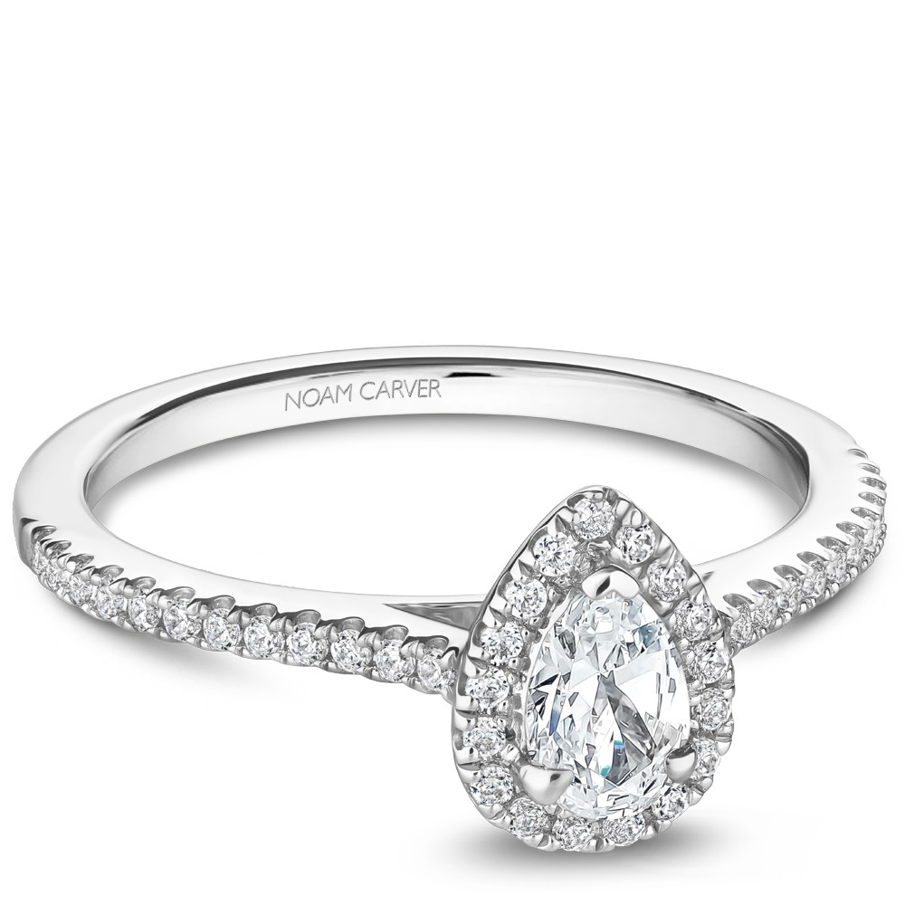 A Carver Studio white gold engagement ring with a pear halo and 45 diamonds.