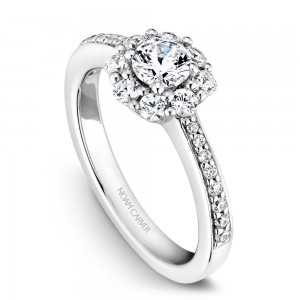 A floral Carver Studio white gold engagement ring with 25 diamonds.