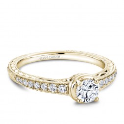 A Carver Studio yellow gold engagement ring with 17 diamonds.