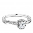 A vintage Carver Studio white gold engagement ring with a halo and 33 diamonds.