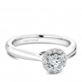 A floral Carver Studio white gold engagement ring with a halo and 13 diamonds.