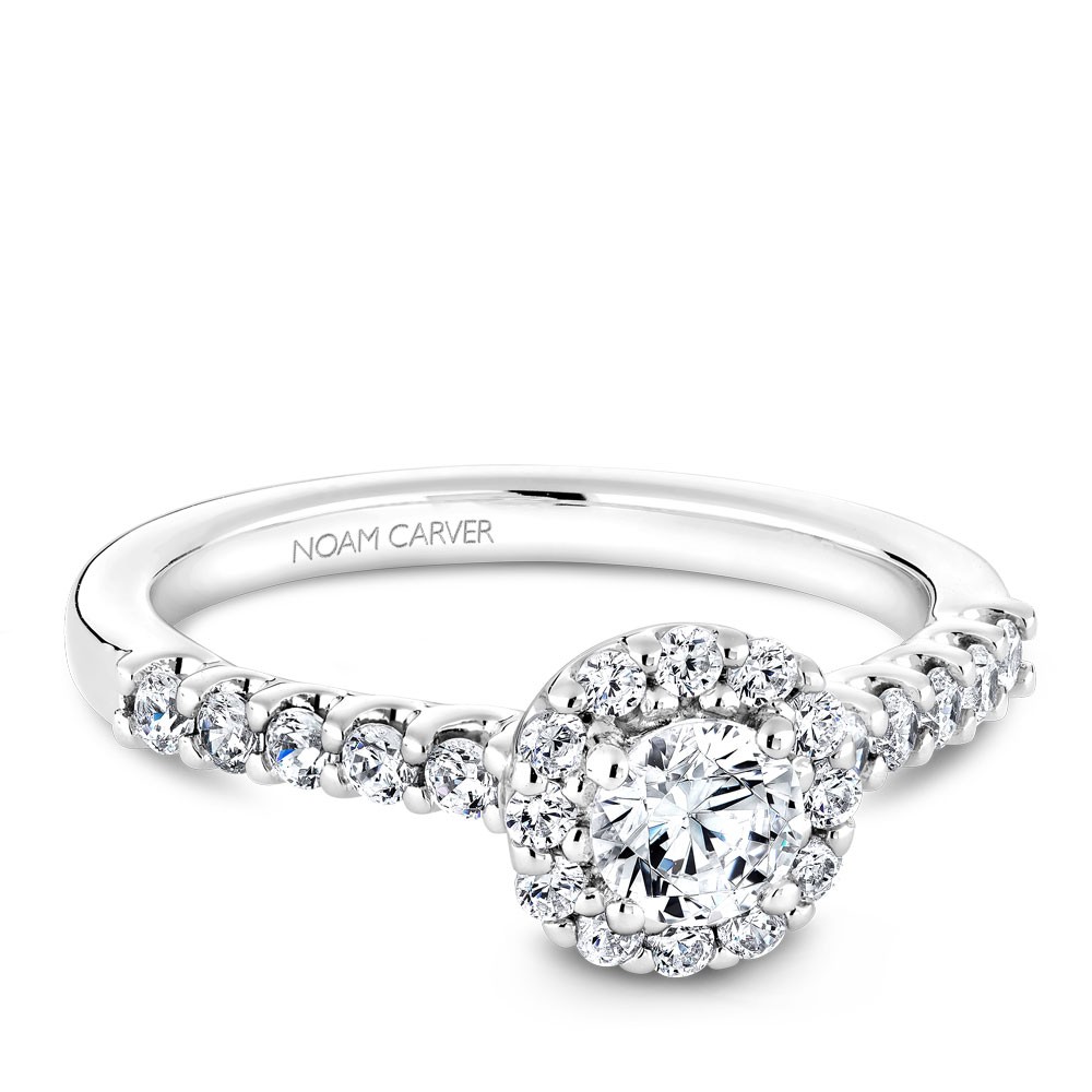 A Carver Studio white gold engagement ring with a halo and 23 diamonds.