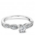 A floral Carver Studio white gold engagement ring with 13 diamonds.