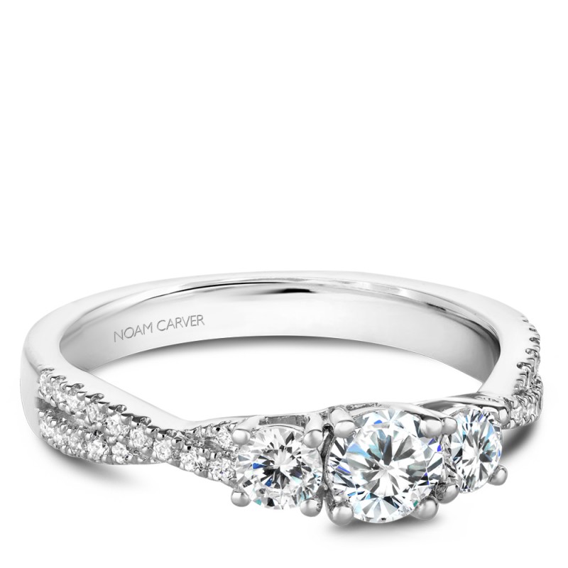 A Carver Studio white gold engagement ring with a twist band and 33 diamonds.