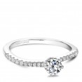 A solitaire Carver Studio white gold engagement ring with 33 diamonds.