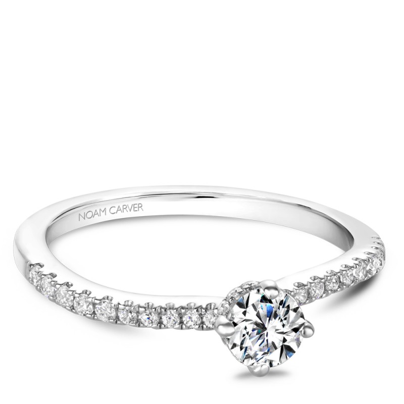 A solitaire Carver Studio white gold engagement ring with 33 diamonds.