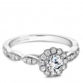 A floral Carver Studio white gold engagement ring with a halo and 31 diamonds.