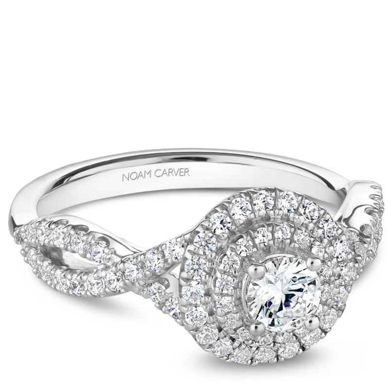 A Carver Studio white gold engagement ring with a twist band, double halo and 71 diamonds.