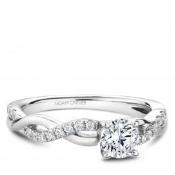 A Carver Studio white gold engagement ring with a twist band and 25 diamonds.