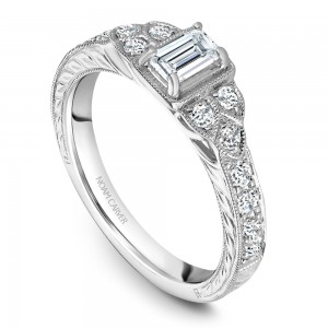 A vintage Carver Studio white gold engagement ring with 16 diamonds.