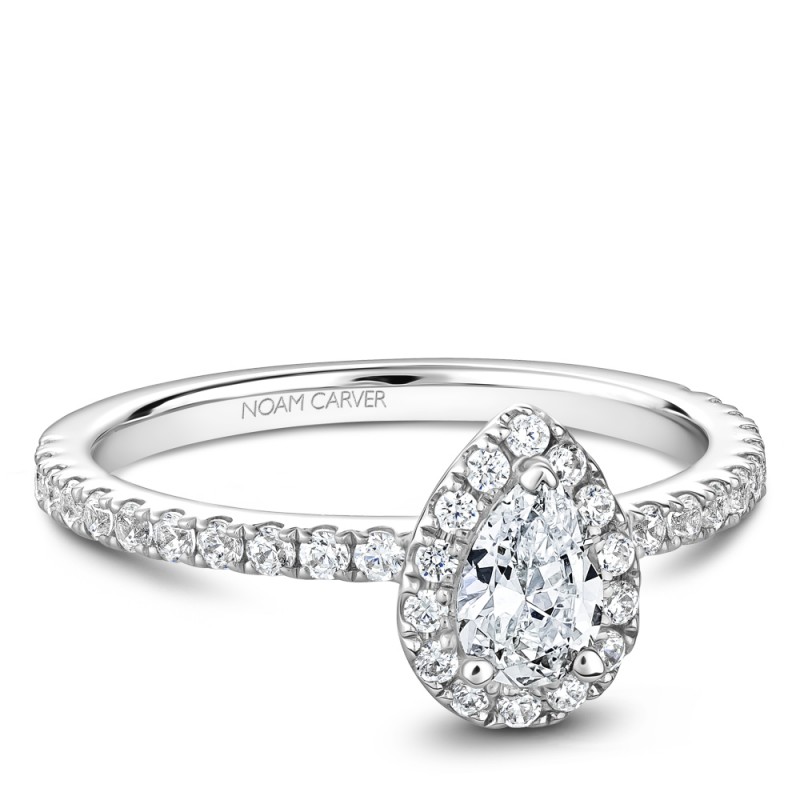 A Carver Studio white gold engagement ring with a pear halo and 37 diamonds.